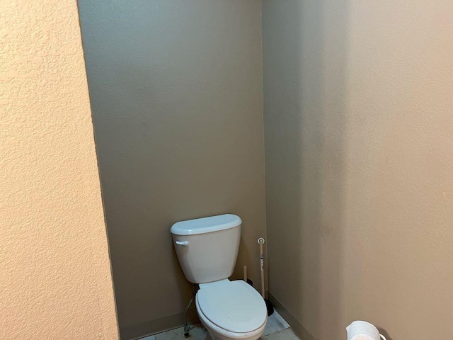 bathroom with tile patterned floors and toilet