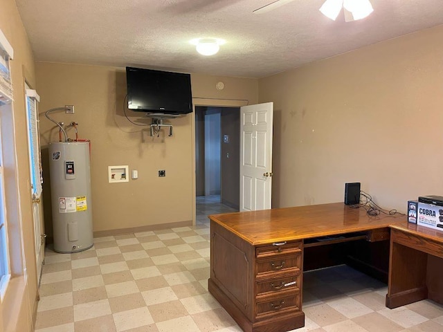 office featuring electric water heater, ceiling fan, and a textured ceiling