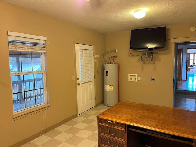 interior space featuring a textured ceiling, beverage cooler, water heater, and a healthy amount of sunlight