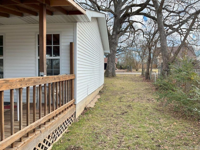 view of property exterior with a lawn