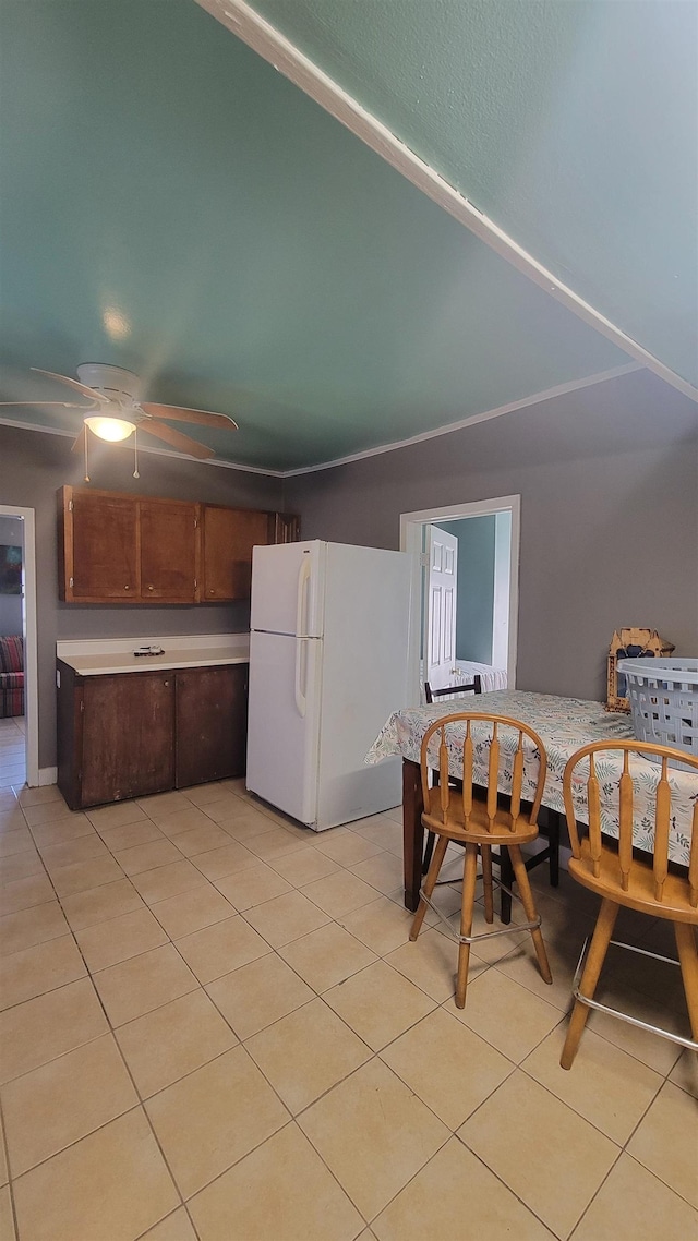 interior space with ceiling fan and light tile patterned floors