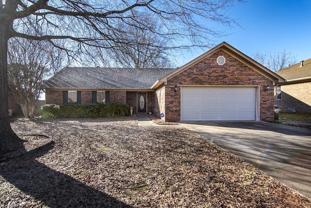 ranch-style house featuring a garage