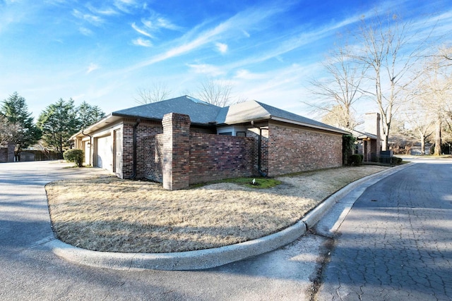 view of property exterior with a garage