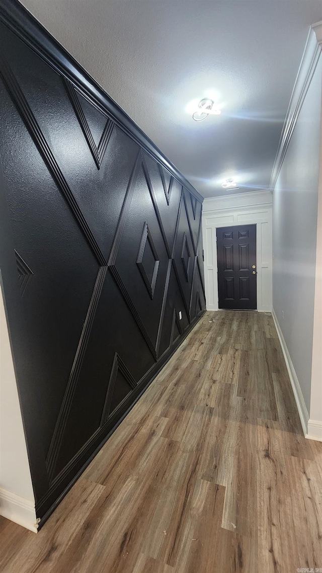 interior space with crown molding and hardwood / wood-style floors