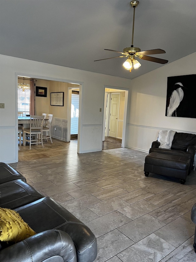 living room with ceiling fan and lofted ceiling