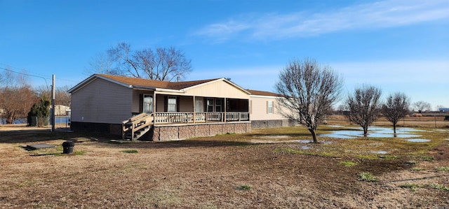 view of front of house featuring a porch and a water view