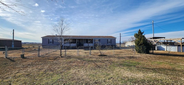 back of house with a lawn