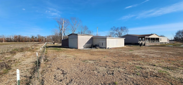 view of outbuilding featuring a lawn