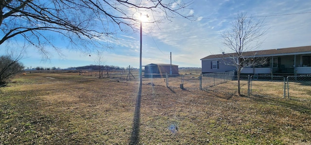 view of yard with a rural view