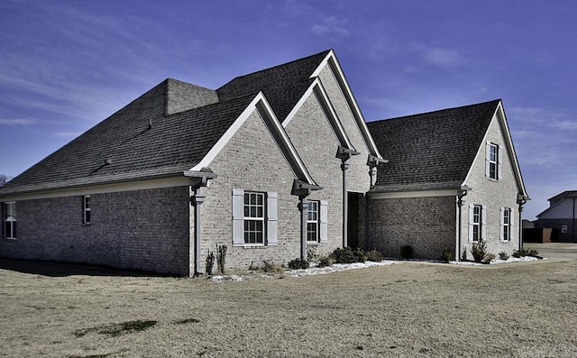 view of home's exterior with a lawn