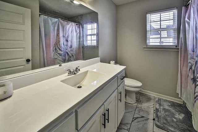 bathroom featuring toilet and vanity