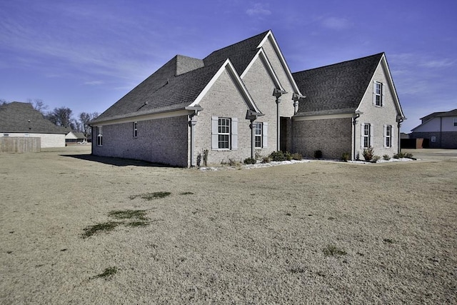 view of property exterior featuring a yard