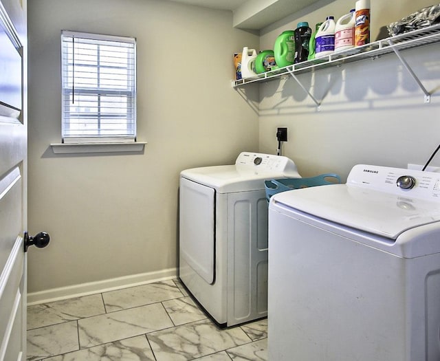 clothes washing area featuring washer and dryer