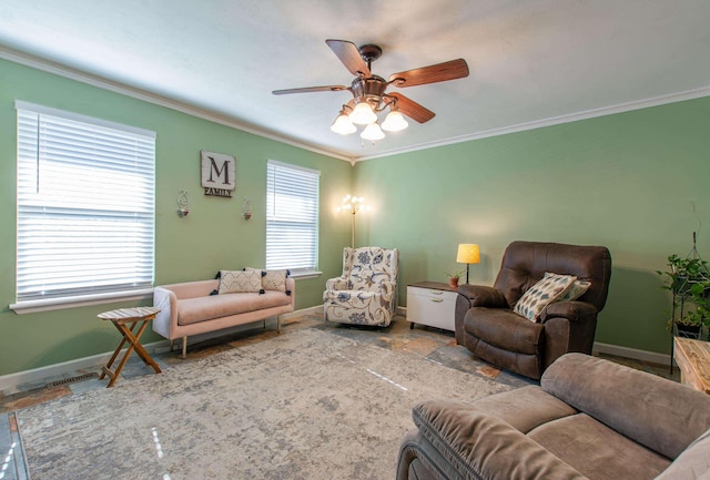 living room featuring ceiling fan and ornamental molding