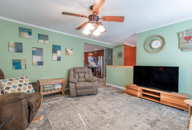 living room featuring ceiling fan and ornamental molding