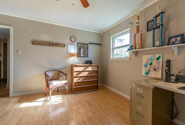 sitting room featuring crown molding, light hardwood / wood-style flooring, and ceiling fan