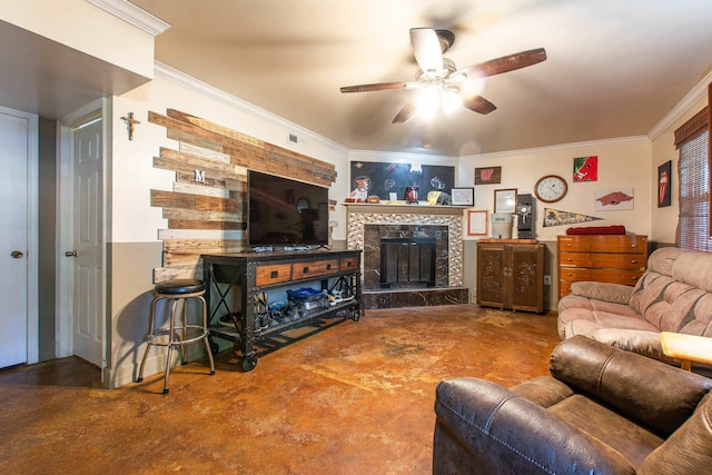 living room featuring concrete floors, a tiled fireplace, ceiling fan, and ornamental molding