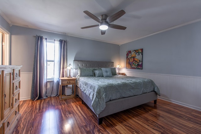 bedroom with dark hardwood / wood-style floors, ceiling fan, and ornamental molding