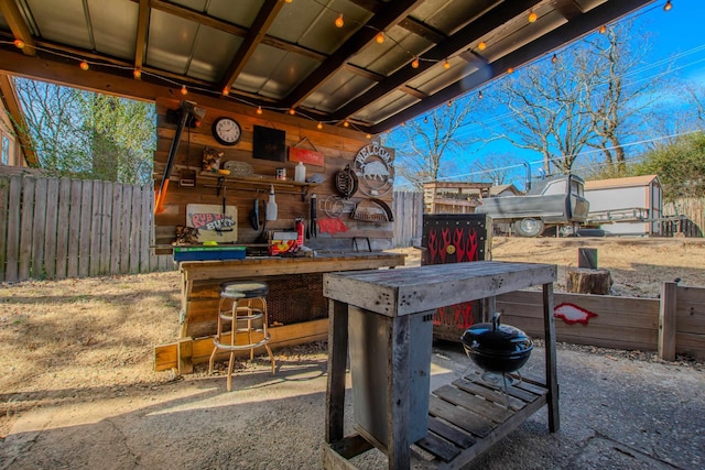 view of patio / terrace featuring an outdoor bar