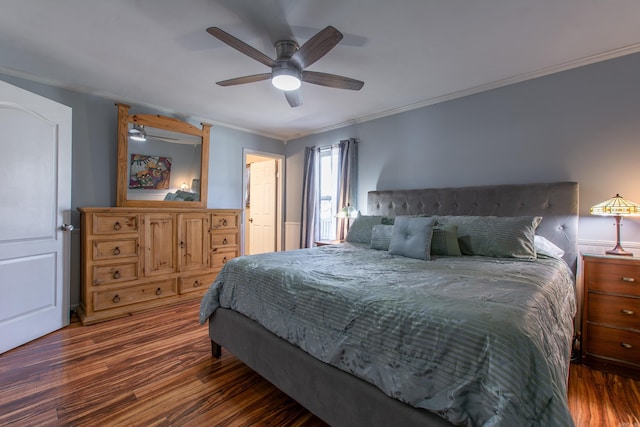 bedroom with ceiling fan, dark hardwood / wood-style floors, and crown molding