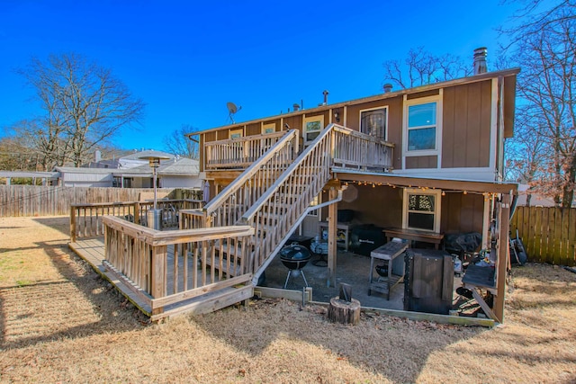 rear view of house with a wooden deck