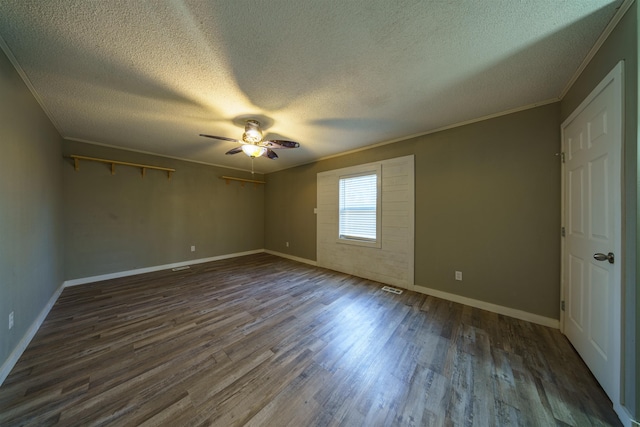 unfurnished room with ceiling fan, dark hardwood / wood-style floors, ornamental molding, and a textured ceiling