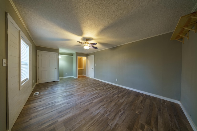 unfurnished bedroom with ceiling fan, wood-type flooring, ornamental molding, and a textured ceiling