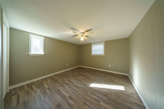 empty room featuring hardwood / wood-style flooring, ceiling fan, and plenty of natural light