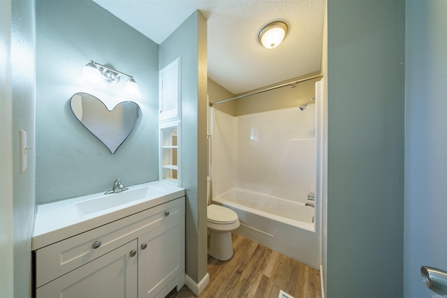 full bathroom with toilet, wood-type flooring, vanity, and shower / bathing tub combination