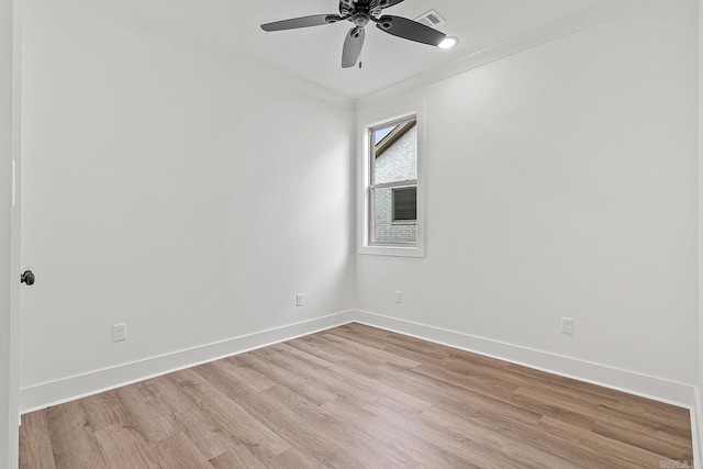 unfurnished room with ceiling fan, light hardwood / wood-style floors, and ornamental molding