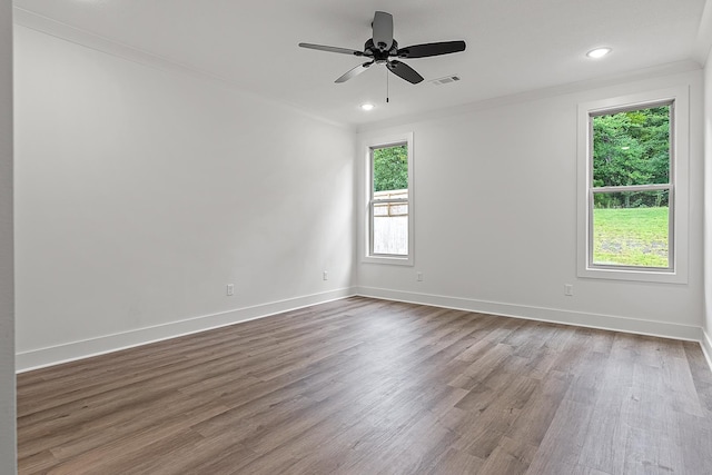 spare room with ceiling fan, ornamental molding, and hardwood / wood-style floors