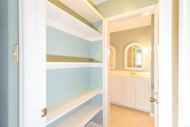 bathroom with vanity and tile patterned flooring