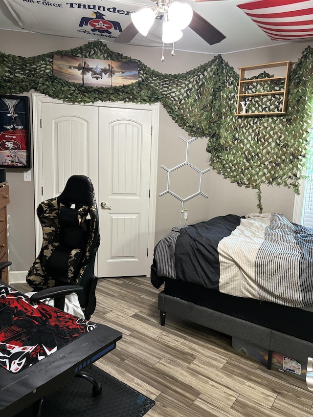 bedroom featuring ceiling fan and hardwood / wood-style floors