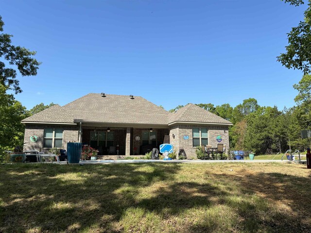 back of property with a yard