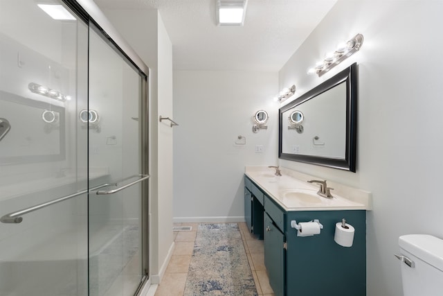 bathroom with toilet, vanity, tile patterned floors, a textured ceiling, and an enclosed shower