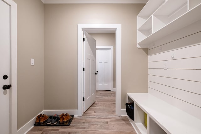 mudroom with light hardwood / wood-style floors