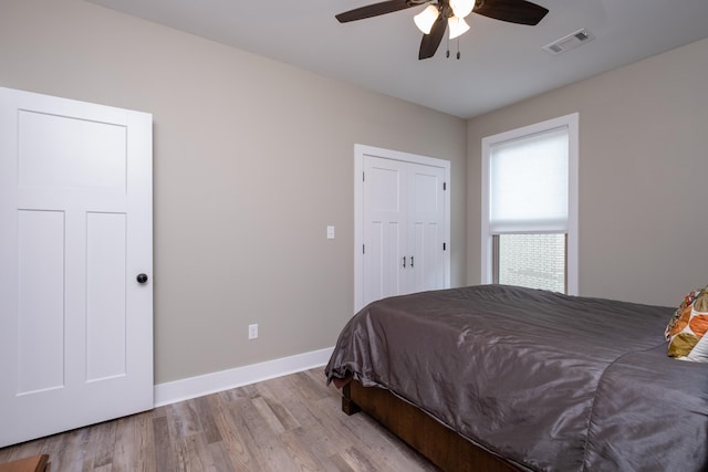 bedroom featuring ceiling fan and light hardwood / wood-style flooring