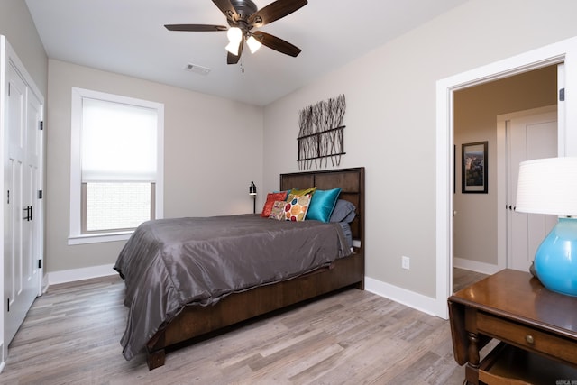 bedroom featuring ceiling fan and light wood-type flooring