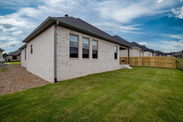 view of home's exterior featuring a lawn