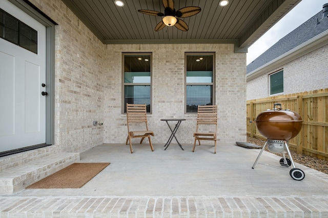 view of patio featuring ceiling fan