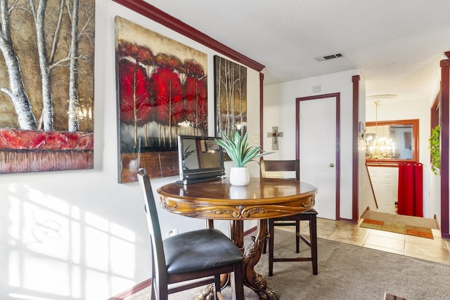 tiled dining room with a textured ceiling