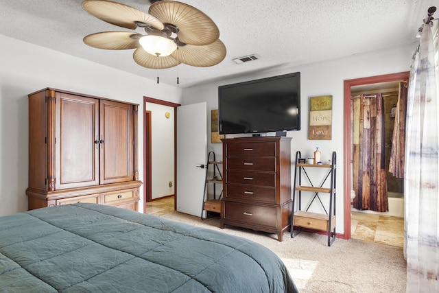 bedroom with a textured ceiling and ceiling fan