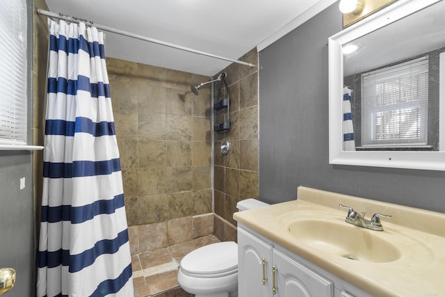 bathroom with toilet, a shower with shower curtain, ornamental molding, and vanity