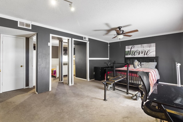 carpeted bedroom with a textured ceiling and ceiling fan