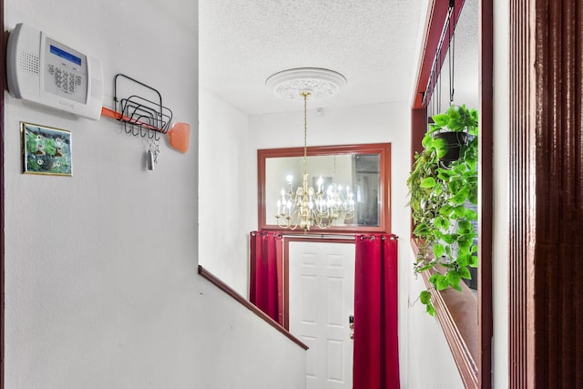 entryway featuring a notable chandelier