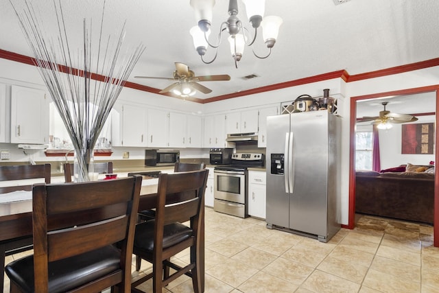 kitchen with light tile patterned flooring, crown molding, stainless steel appliances, and white cabinetry