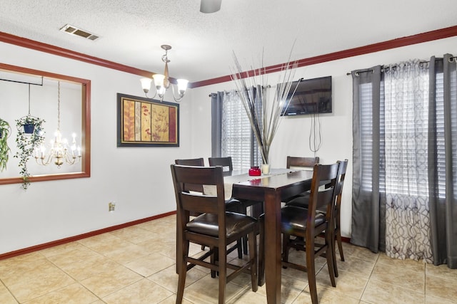 dining space featuring a notable chandelier, tile patterned floors, crown molding, and a textured ceiling