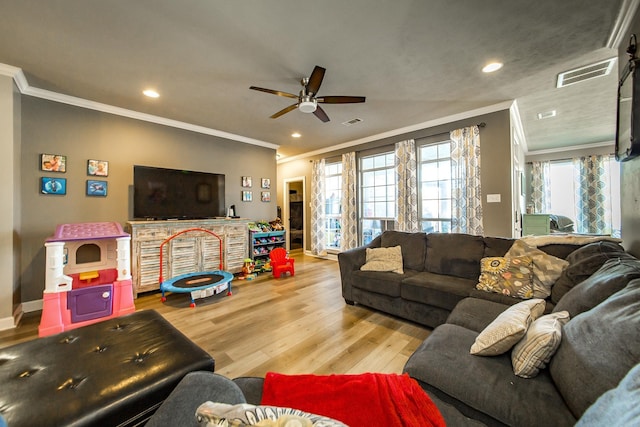 living room featuring hardwood / wood-style flooring, crown molding, and ceiling fan