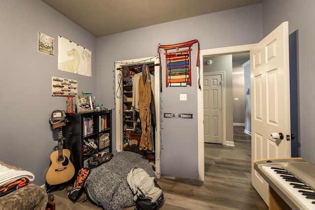 bedroom with hardwood / wood-style floors