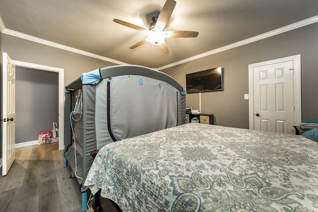 bedroom with ceiling fan, dark wood-type flooring, and ornamental molding